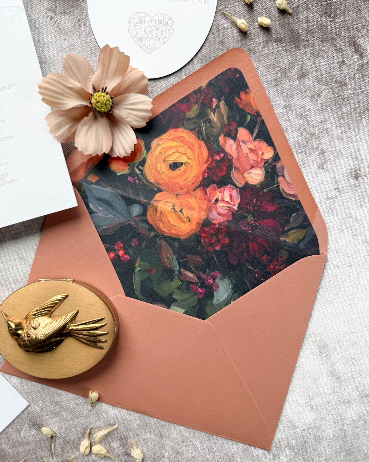 Floral envelope with a decorative liner on a textured surface
