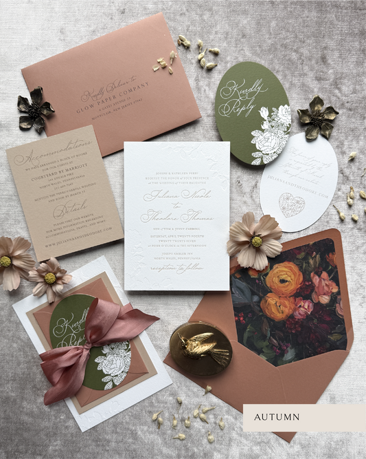 Collection of autumn-themed stationery items on a textured surface.