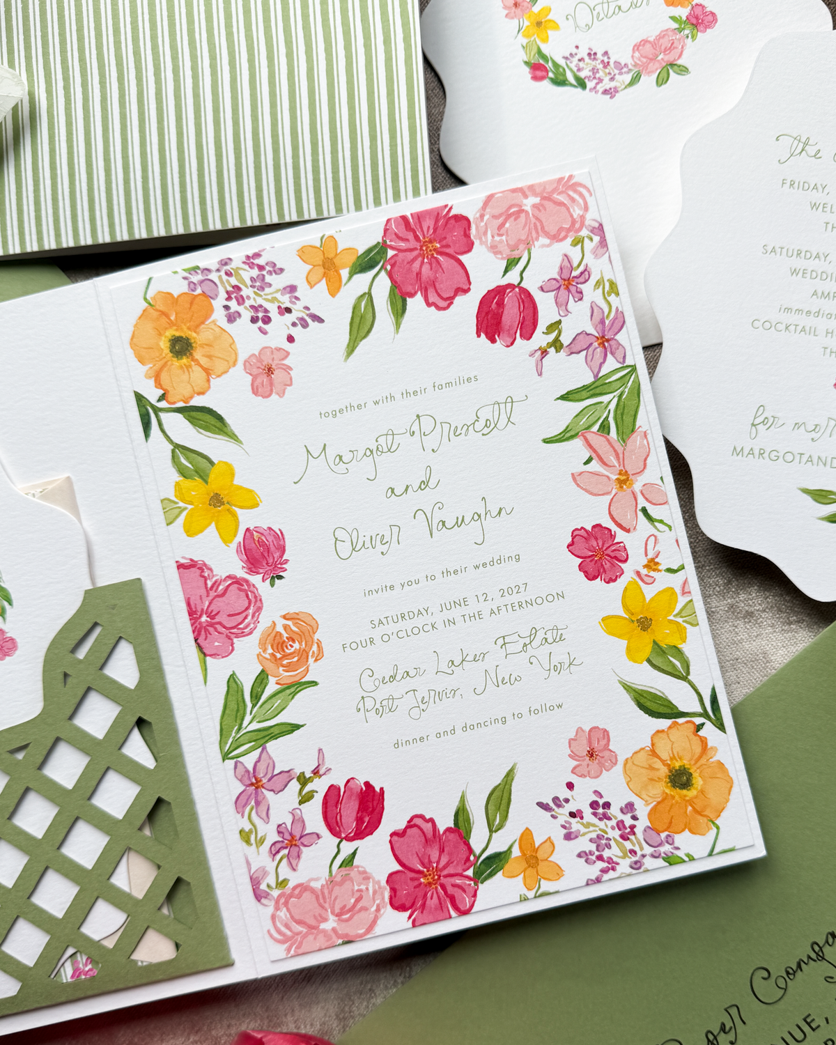 A wedding invitation with whimsical font and handpainted floral watercolor art in bright, bold colors