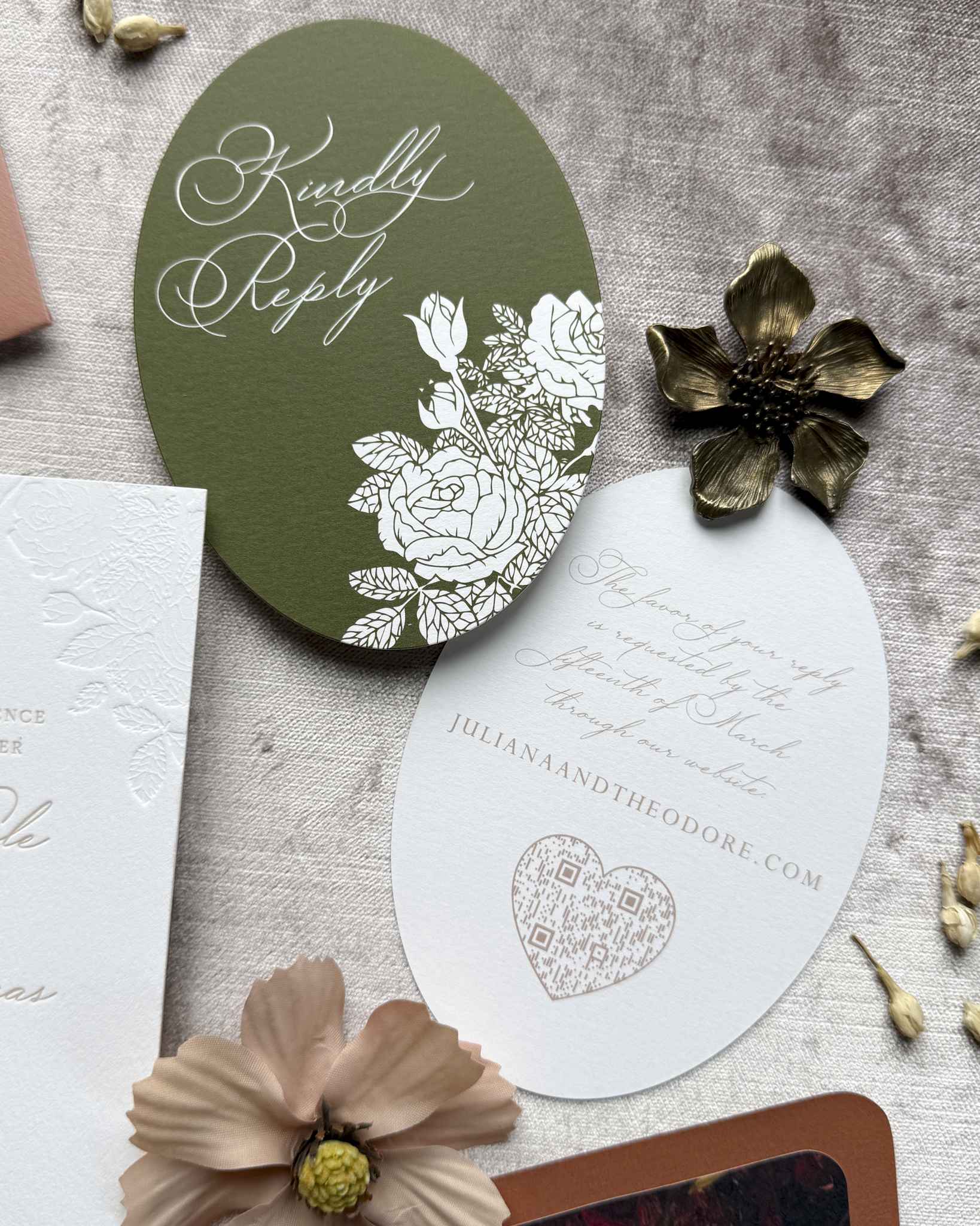 Invitation card with floral design and text on a textured surface with flowers.