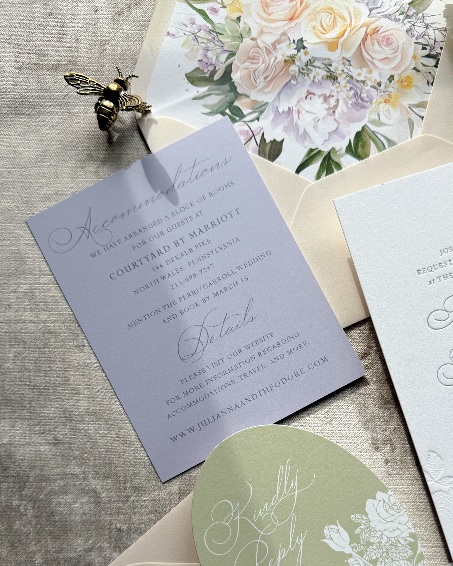 Wedding invitation lavender card with floral design on a textured surface