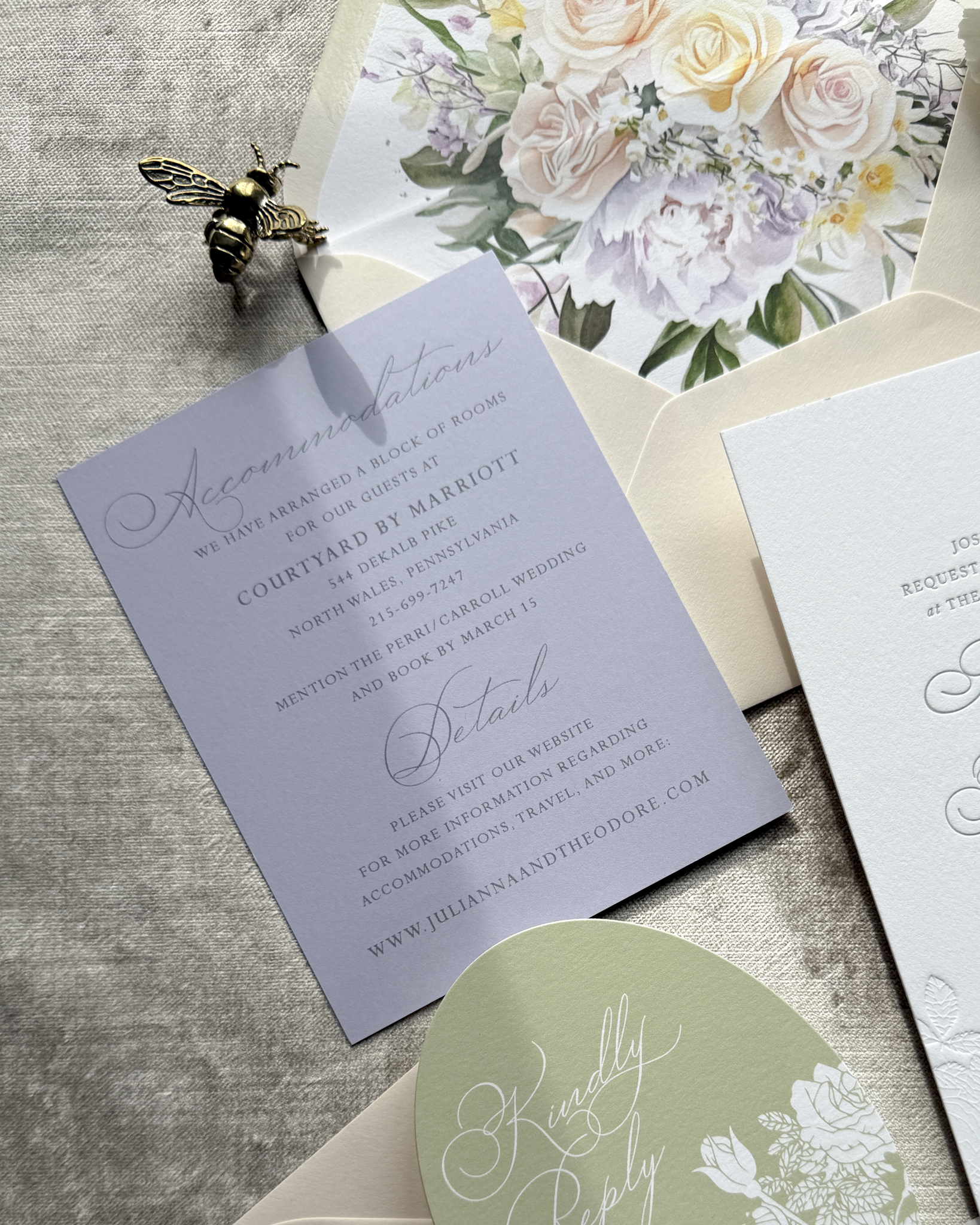 Wedding invitation lavender card with floral design on a textured surface