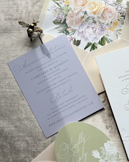 Wedding invitation lavender card with floral design on a textured surface