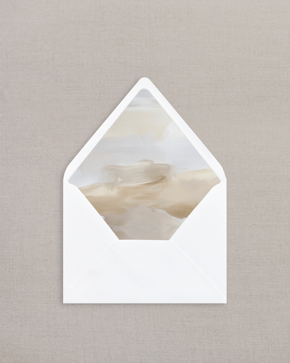 White envelope with a marble-patterned interior on a beige background