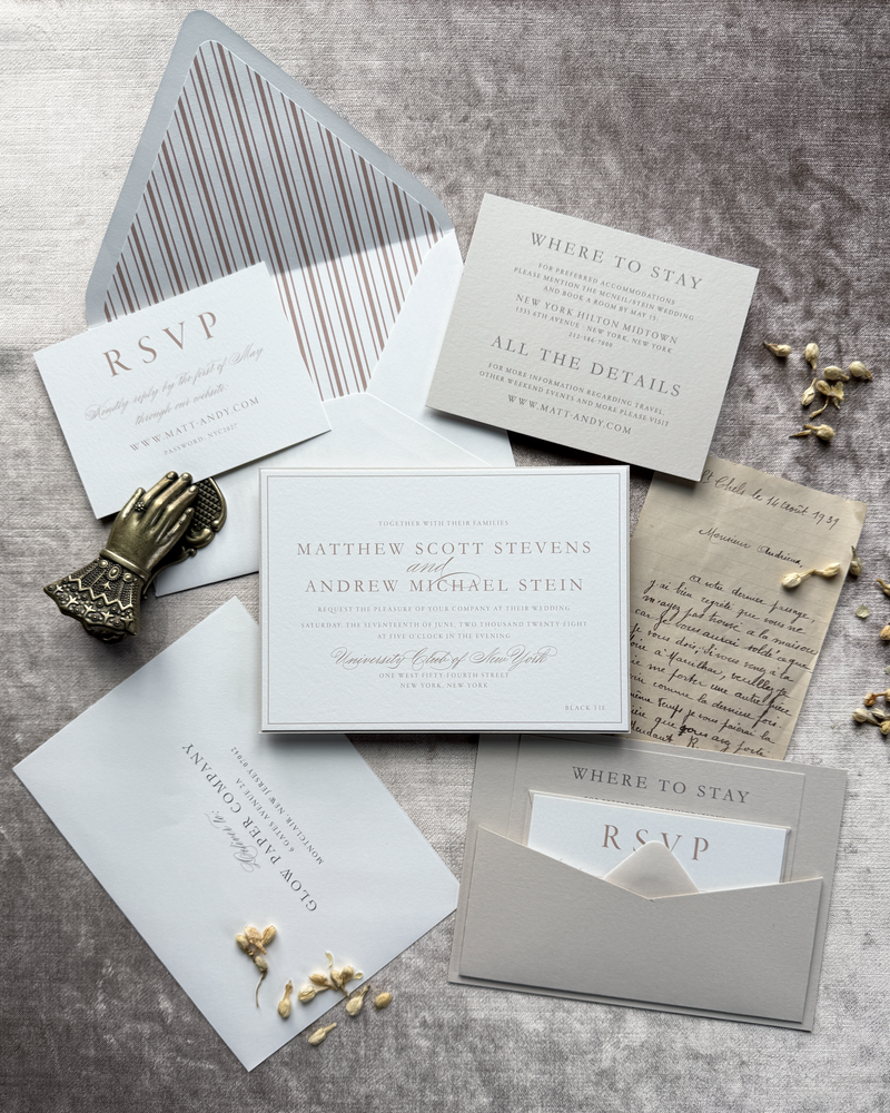 A chic neutral wedding invitation featuring a back pocket and pinstripe liner